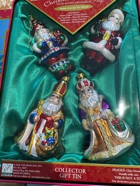 Santas Around The World Hand Blown Ornaments. Unused and sealed in Tin from 2000